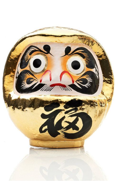 gold daruma doll